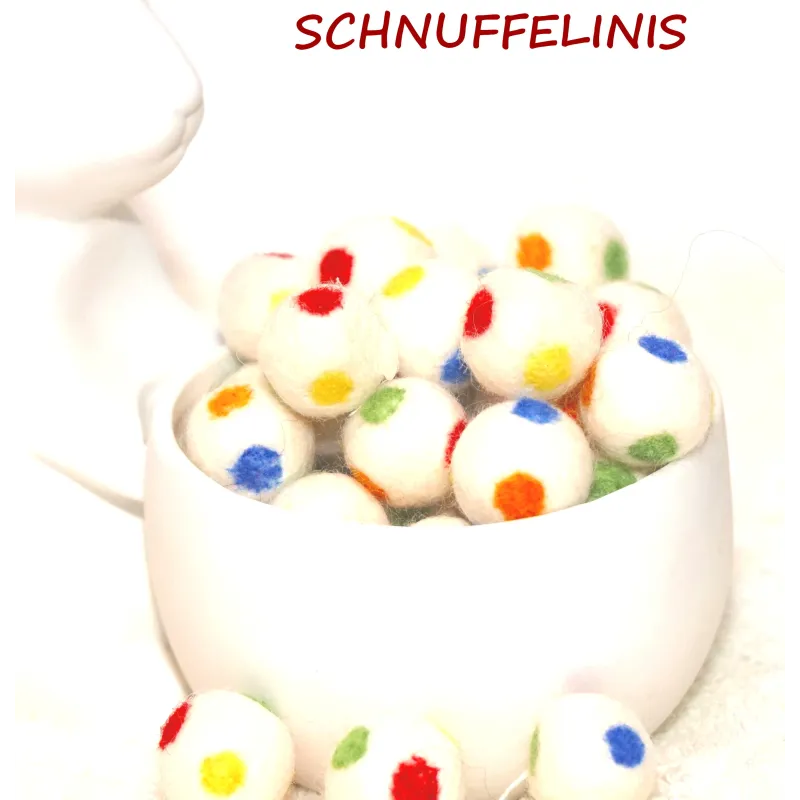 Felt balls with colorful dots, rainbow-colored felt balls in white Felt balls with colorful dots, rainbow-colored felt balls in white